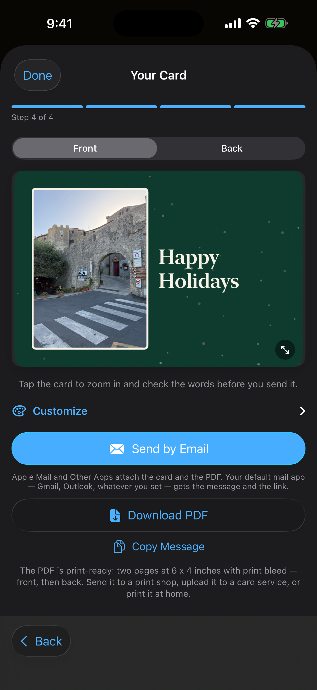 The Create Card preview step on iPhone: a green Happy Holidays postcard with a photo on the front, and buttons to send it by email or download a print-ready PDF