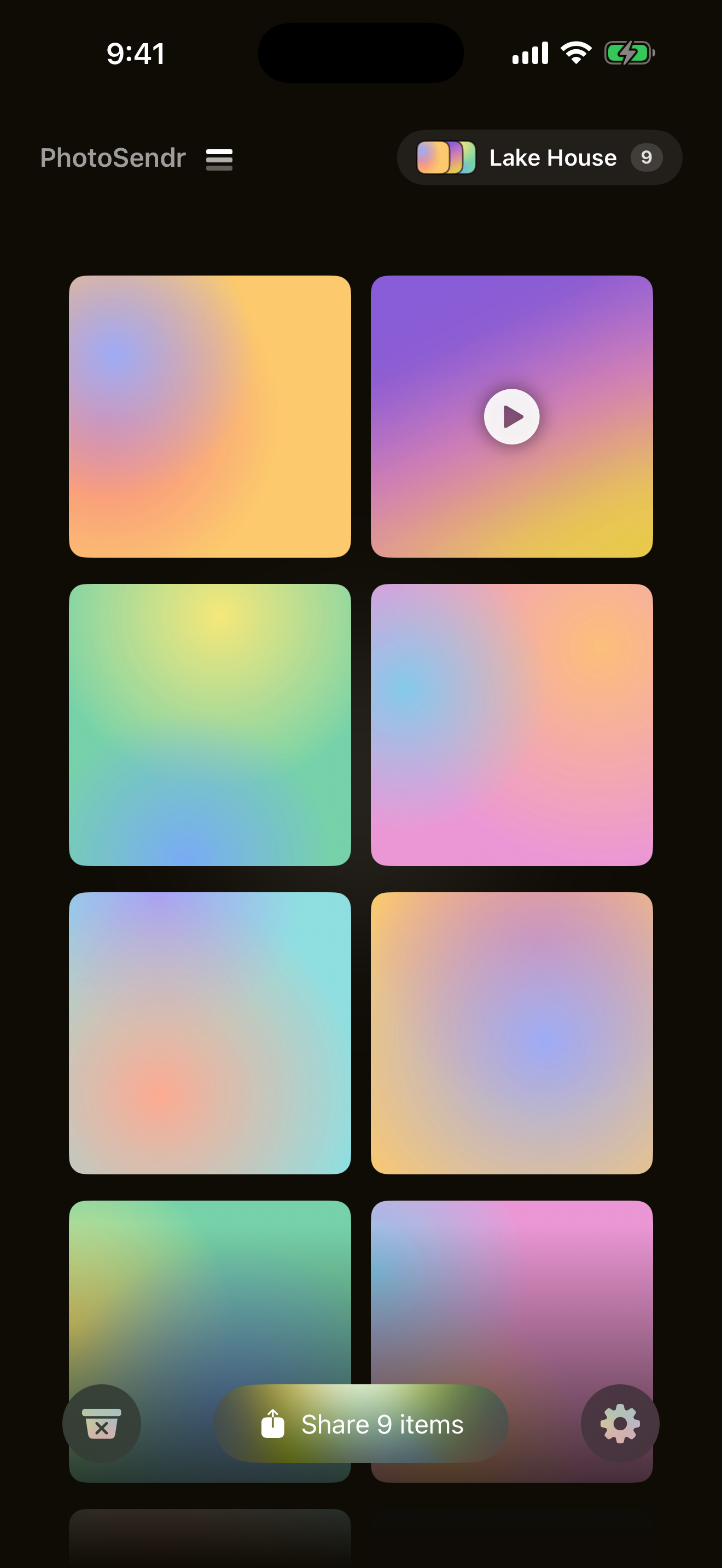 The PhotoSendr grid on iPhone with eight photos and a video